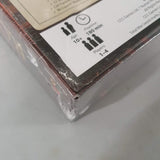 Close-up of a CCC Games Total War: ROME The Board Game (Damaged) box corner shows a torn wrap, age 10+, 180 min playtime, and 1-4 players—hinting at epic Ancient World battles inside.