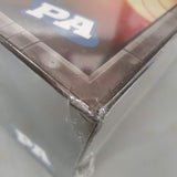 Close-up of a dented corner on a cardboard box with plastic wrap. The partially visible "PA" hints at Clank! Legacy: Acquisitions Incorporated (Damaged) by Dire Wolf, a popular legacy-style deck-building board game.