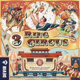 The 3 Ring Circus board game by Devir features an illustrated cover with acrobats, clowns, a horse rider, and an ornate circus wagon, evoking the grand era of P.T. Barnum around bold decorative title text.