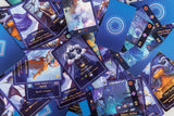 A scattered pile of Aquatica EN/DE playing cards by Cosmodrome Games showcases vibrant sea creature illustrations, underwater kingdoms, detailed icons, and striking blue patterned backs.