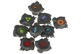 Aquatica EN/DE by Cosmodrome Games includes eight black plastic tokens featuring colorful sci-fi symbols—red, green, blue, orange, and purple—each with wavy edges, evoking mysterious underwater artifacts for an immersive ocean board game experience.