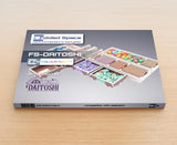 A Folded Space - Daitoshi Insert by Folded Space is displayed on a wooden surface, with its cover showing colorful game trays neatly organizing vibrant pieces and components.