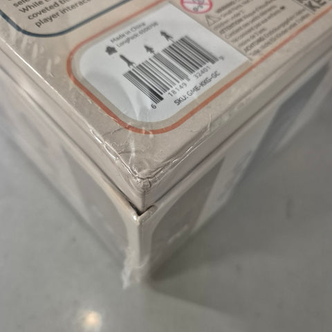 A close-up shows the dented corner of a shrink-wrapped Galactic Cruise (Damaged) board game by Kinson Key Games, with a visible barcode label on the top.