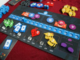 A close-up of Hegemony - 3D Upgraded Components by Game Maker Team, showing colorful leaf, phone, apple, and bird tokens with numbers and symbols in play on a “Capitalist Class” board atop a red tabletop.