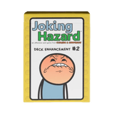 A yellow box for Joking Hazard: Deck Enhancement #2 Expansion by Breaking Games. The box shows a cartoon character with an exaggerated, uncomfortable face, matching the comic-based card game's quirky theme.