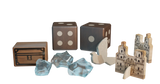 A set of pieces from Pax Hispanica Deluxe Edition by Ion Game Design, featuring two brown dice, a wooden treasure chest, four translucent crystals, a white triangular piece, and two arched wooden building tokens.