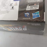 Close-up of the Power Rangers: Heroes of the Grid (Damaged) box by Renegade Game Studios, showing logos, a warning label, partial product text, and shrink wrap on the packaging.