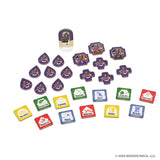 Colorful game pieces and tokens from WizKids’ Tales of the Arthurian Knights, featuring fantasy icons inspired by King Arthur and his knights, displayed in purple, yellow, green, red, and blue on a white surface.