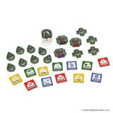 Colorful tokens and tiles from WizKids' *Tales of the Arthurian Knights* are spread out, displaying icons, words, and colors like blue, red, green, and yellow—perfect for this storytelling board game about King Arthur and his knights.