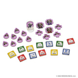 Colorful tokens from WizKids' "Tales of the Arthurian Knights" board game are arranged on a white surface, featuring unique icons and characters inspired by King Arthur and his legendary knights.