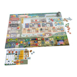 The White Castle: Matcha Expansion by Devir features colorful illustrated boards, cards, dice, tokens, and wooden pieces—including the Matcha set—neatly arranged on and around the main board and a player board for organized play.