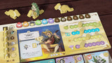 Wondrous Creatures by Bad Comet is a vibrant strategy board game featuring a fantasy-themed player board, icons, wooden dinosaur and egg tokens, a score track, cards, and worker placement pieces arranged neatly on a wooden table.