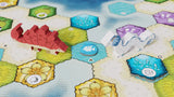 Two wooden game pieces—a red stegosaurus and a white dragon—stand on the vibrant hexagonal board of Wondrous Creatures by Bad Comet, perfect for strategy fans who love colorful icons, flowers, and varied terrain.