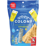 A blue resealable bag of the Word Colony Bundle by Pegasus Spiele features images of the Leaning Tower of Pisa, a Moai statue, and a pyramid, along with cards and travel-themed graphics on the packaging.