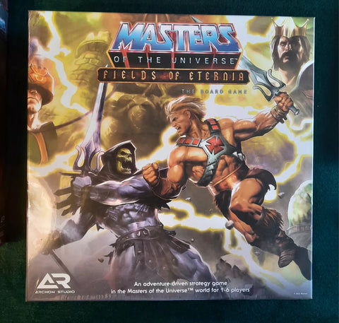 Box cover of Masters of The Universe: Fields of Eternia The Board Game by Archon Studio, showing He-Man vs Skeletor with miniatures in action, iconic characters and lightning, plus the game title for ultimate 80s nostalgia.